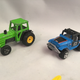 Majorette tractor and a Hot Wheels Landcruiser.